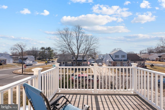 wooden deck featuring a residential view