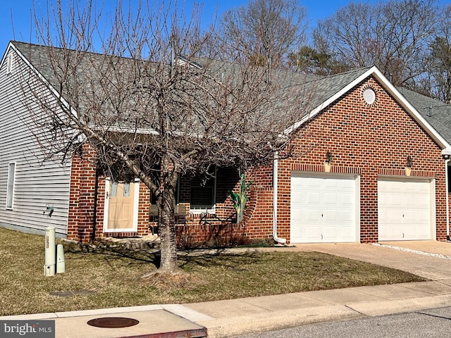 view of front of home with an attached garage, covered porch, driveway, and brick siding