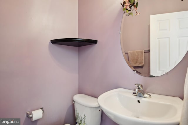 bathroom with a sink and toilet