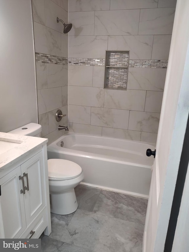 full bath featuring bathtub / shower combination, vanity, and toilet