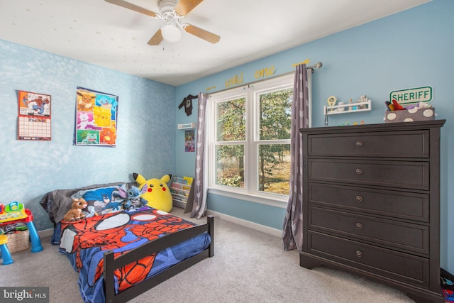 bedroom featuring carpet flooring, a ceiling fan, and baseboards