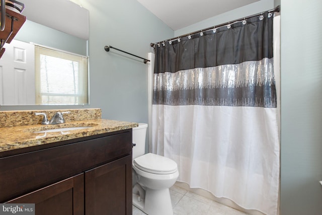 bathroom featuring vanity, tile patterned floors, toilet, and a shower with curtain