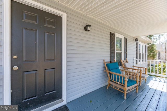 wooden terrace with a porch