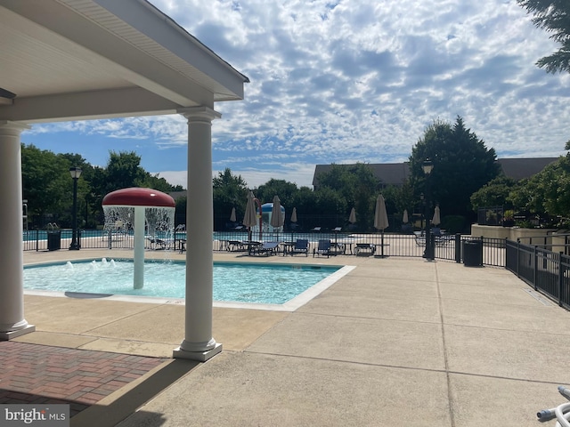 community pool featuring fence