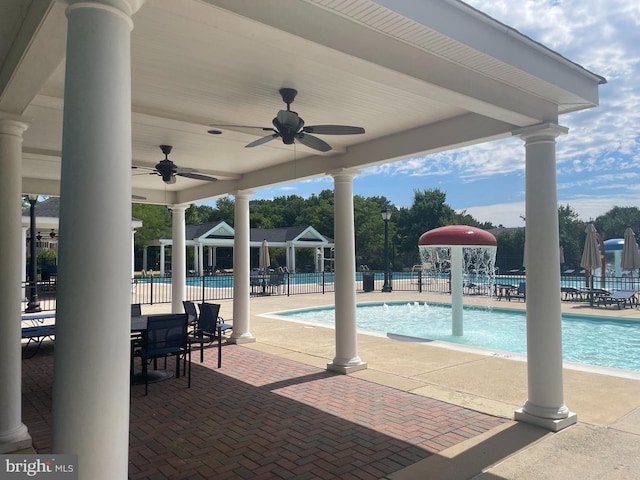 pool featuring a patio and fence