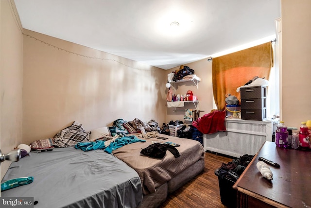 bedroom featuring wood finished floors