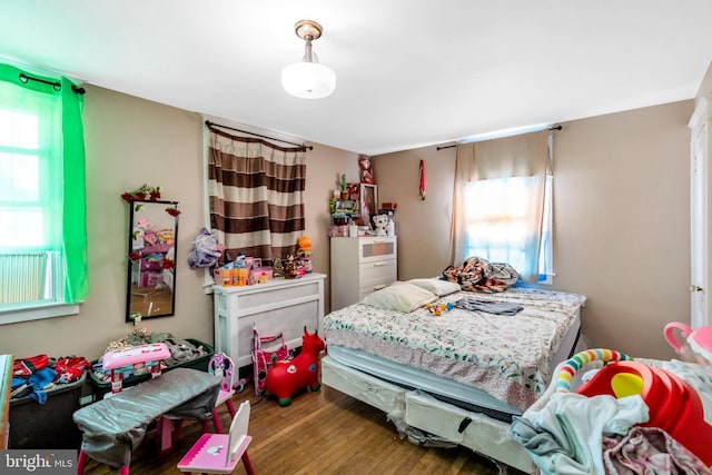 bedroom featuring wood finished floors