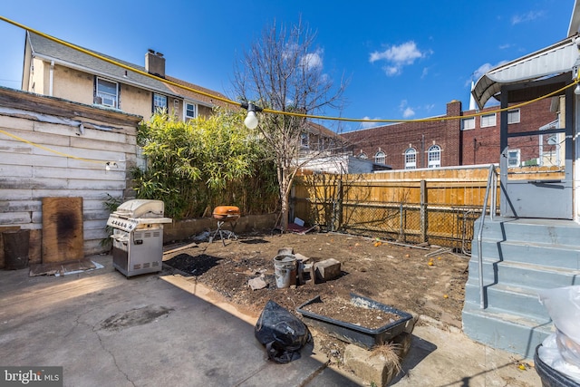 view of yard featuring a patio and fence