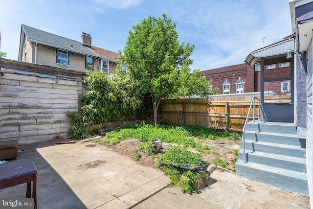 fenced backyard featuring a patio area