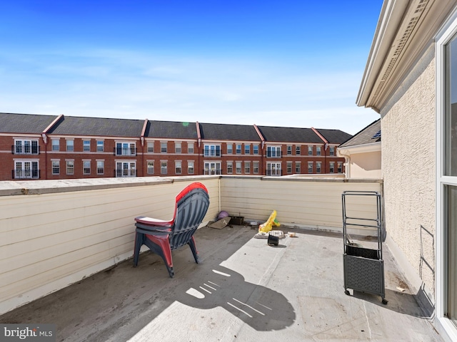 view of patio featuring a balcony