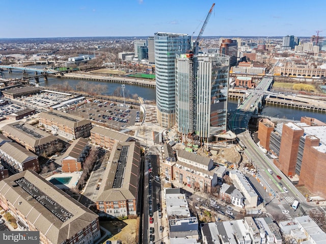 drone / aerial view with a view of city and a water view