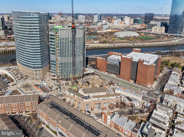 birds eye view of property featuring a view of city and a water view