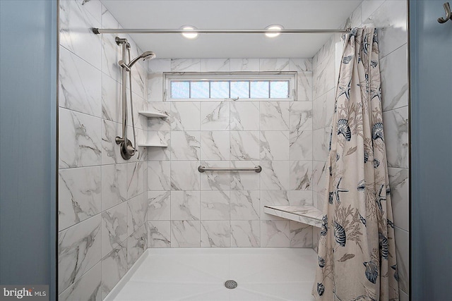 full bath with a shower stall