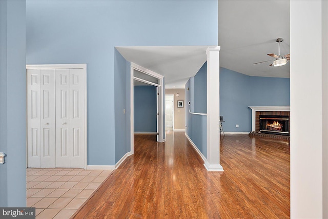 hall featuring baseboards and wood finished floors