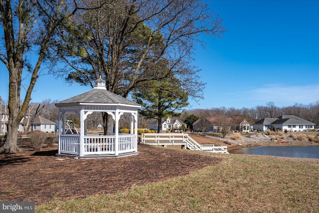 view of yard featuring a gazebo and a water view