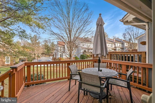 wooden deck with a residential view