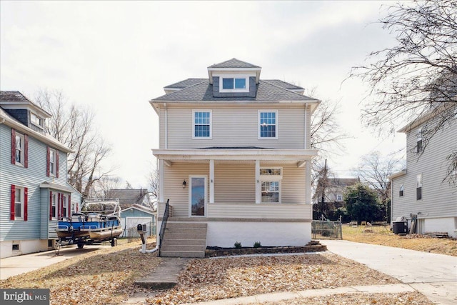 traditional style home featuring a porch and central AC