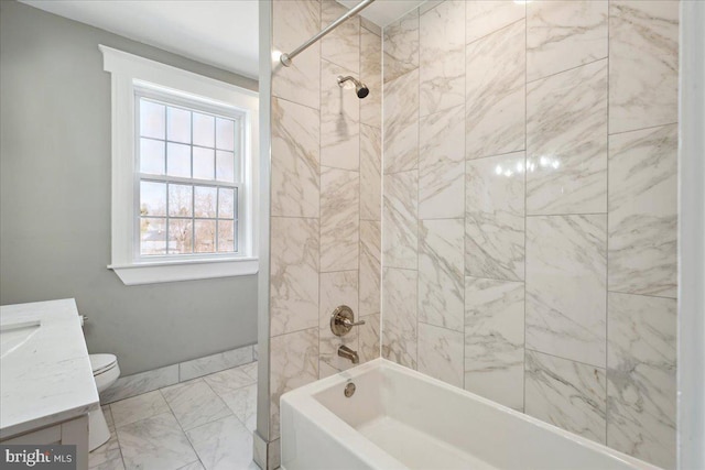 bathroom with marble finish floor, toilet, vanity, and shower / tub combination