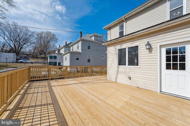 wooden deck featuring a residential view