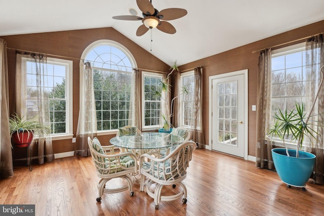 sunroom with lofted ceiling and ceiling fan