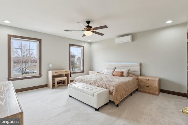 bedroom featuring an AC wall unit, light colored carpet, and baseboards