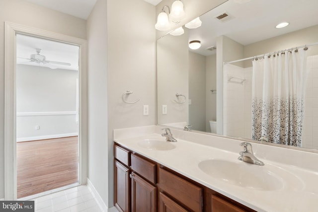 full bathroom featuring a sink, visible vents, toilet, and tile patterned flooring