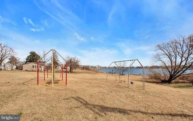 communal playground with a yard and a water view