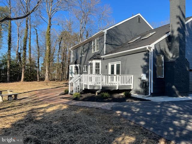 view of home's exterior featuring a deck