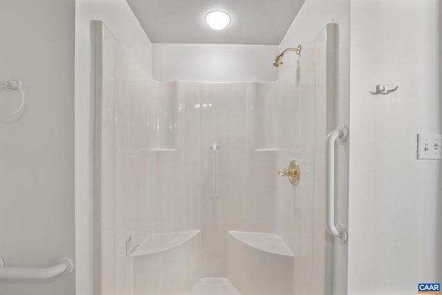 full bath featuring a shower stall