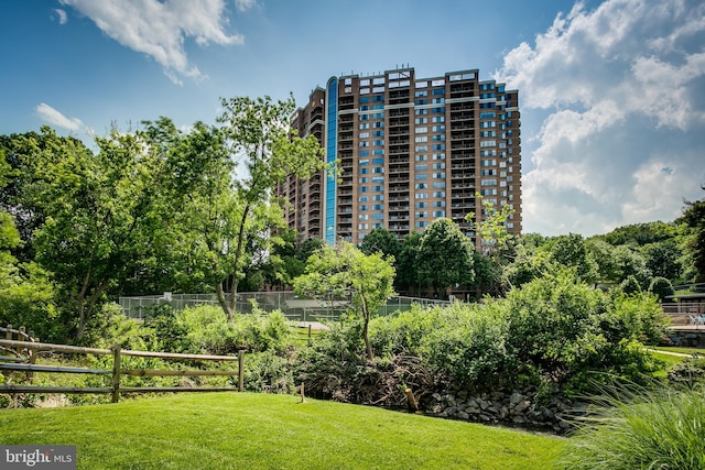 view of property with fence