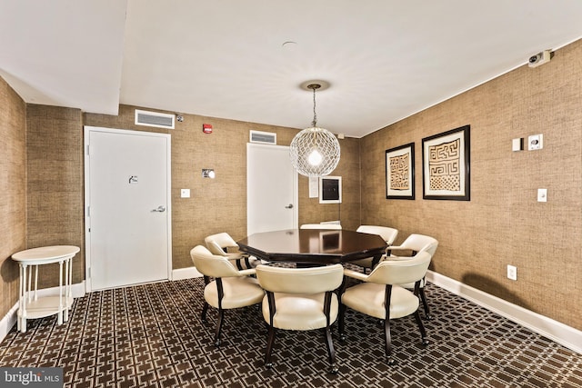 dining room with visible vents and baseboards