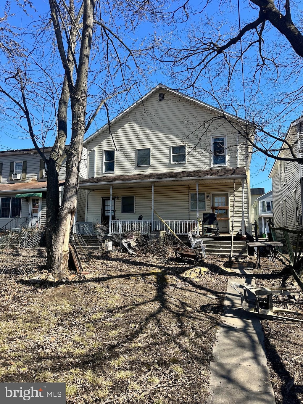 rear view of house with covered porch