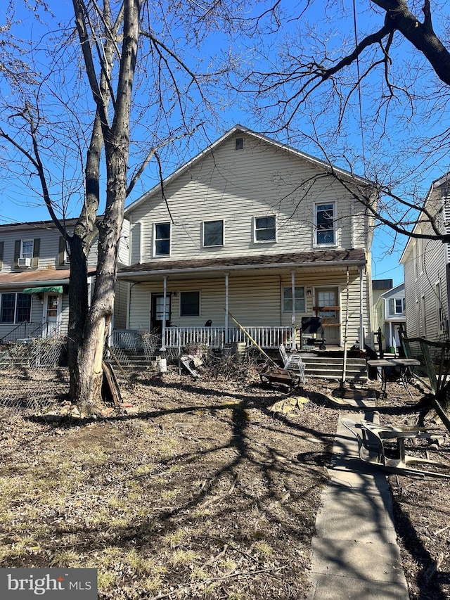 rear view of house with covered porch