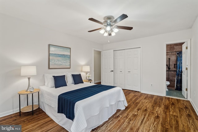 bedroom with baseboards, a ceiling fan, connected bathroom, wood finished floors, and a closet