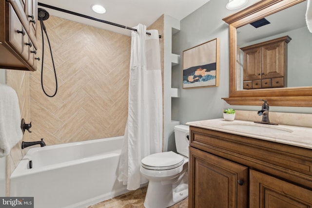 full bath with shower / bath combo, vanity, and toilet