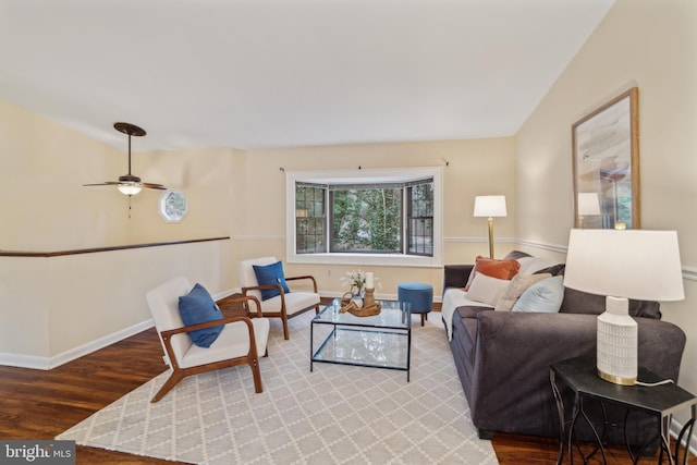 living area with wood finished floors and baseboards