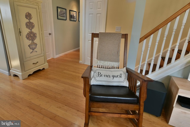 interior space with baseboards and wood finished floors