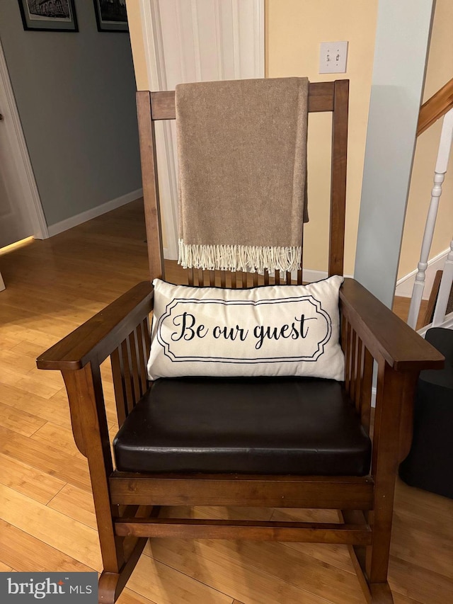 room details with baseboards and wood finished floors