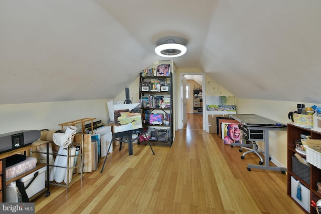 office area with lofted ceiling and wood finished floors