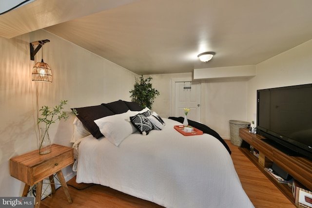 bedroom with wood finished floors