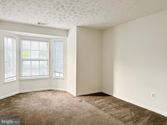 8961 Town Center Cir Unit 1-203, Upper Marlboro, MD 20774 - unfurnished room with carpet floors, baseboards, and a textured ceiling