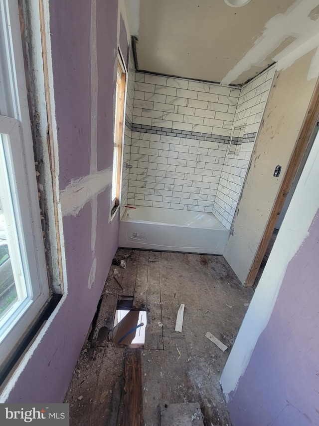bathroom featuring a bathing tub and wood finished floors