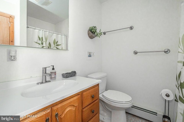 bathroom with toilet, baseboard heating, vanity, and visible vents