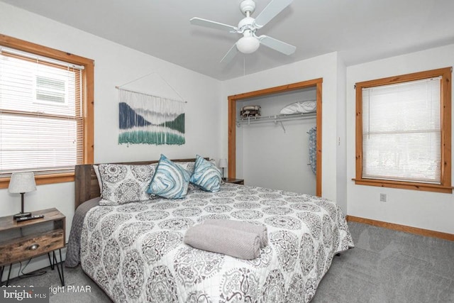 carpeted bedroom featuring a ceiling fan, a closet, and baseboards