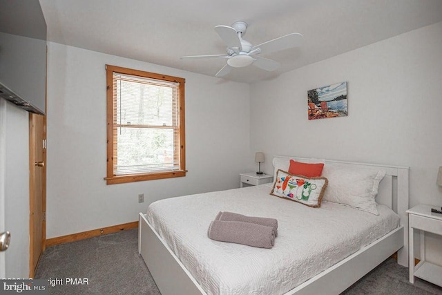 carpeted bedroom with baseboards and a ceiling fan