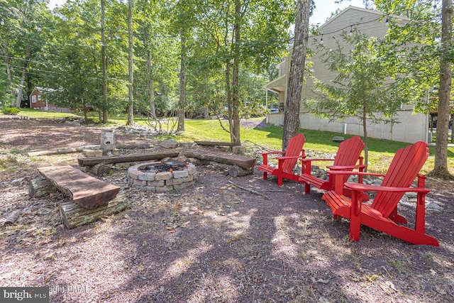 view of yard featuring an outdoor fire pit