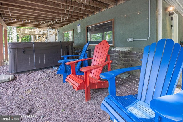 view of patio / terrace featuring a hot tub