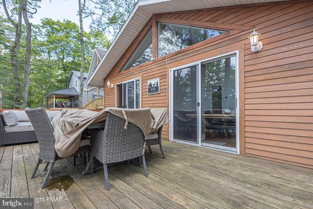 wooden terrace with a gazebo