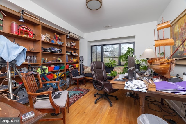 home office with wood finished floors