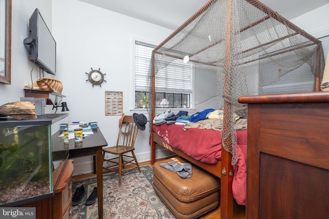 bedroom featuring baseboards